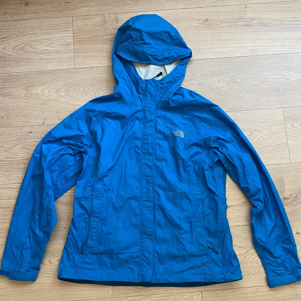 The North Face teal rain breaker